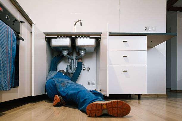 Professional Plumbing technician working in Harbeson, DE